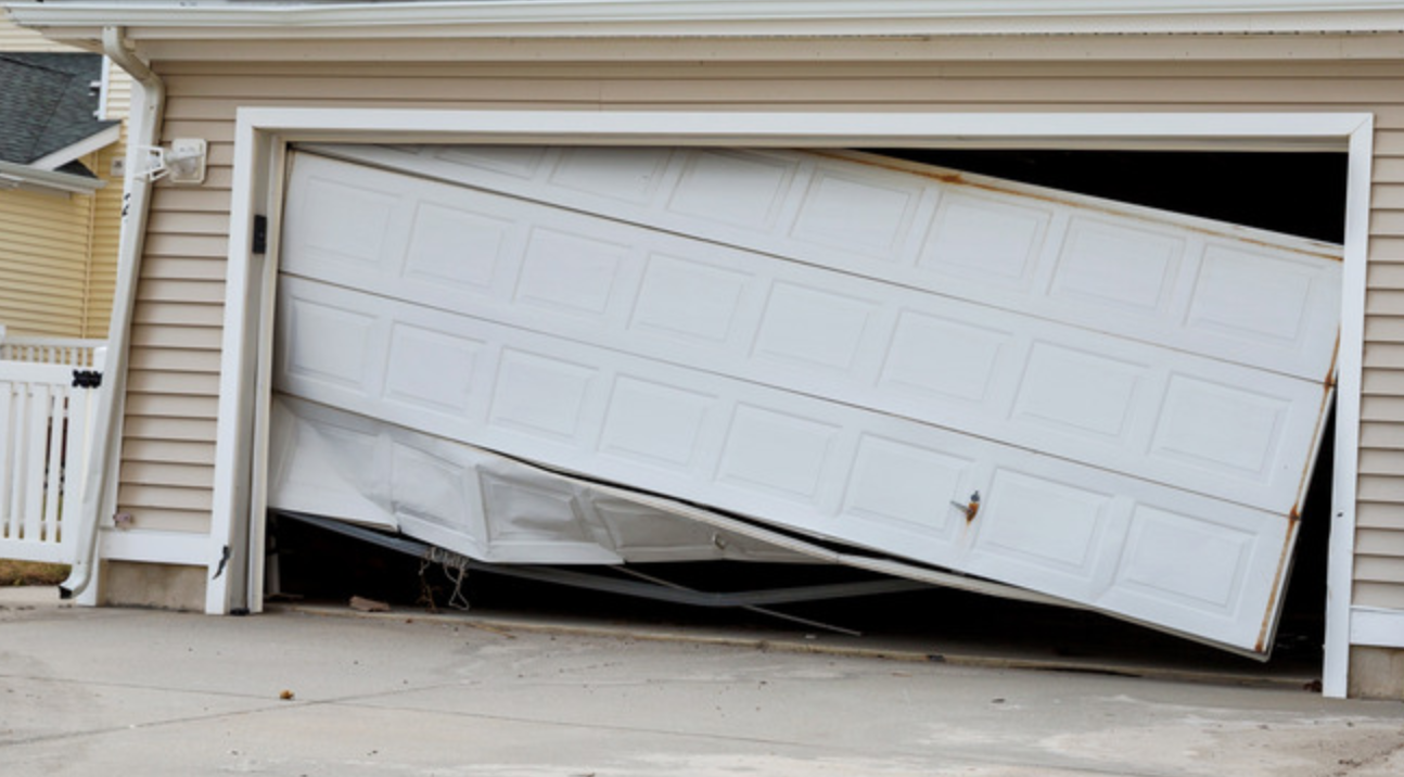 A vintage garage door with a prohibition symbol painted on it.